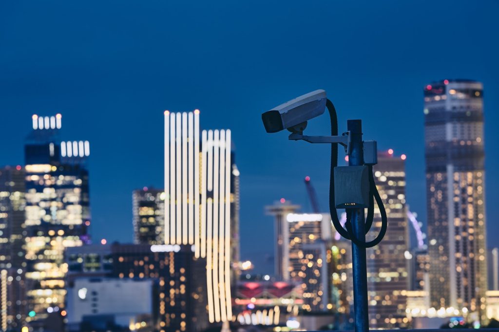Security camera against urban skyline